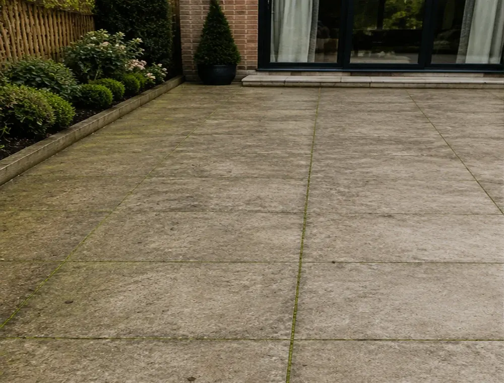 Dirty porcelain patio before cleaning